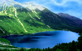 Mountain range lake blue sky - a lake in the middle of it free wallpaper