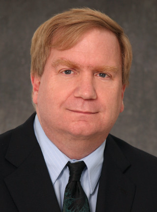 Man suit tie smirk serious - free portrait wallpaper for mobile