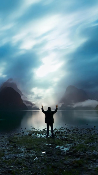 Man beach arms up mountains - a matte painting free wallpaper for mobile