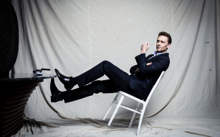 Man suit sitting chair legs - glamor pose free wallpaper