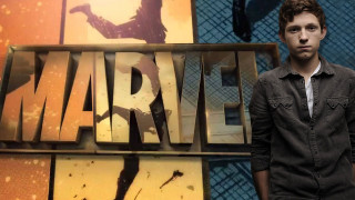 Man standing wolverine logo sign - marvel comic free wallpaper