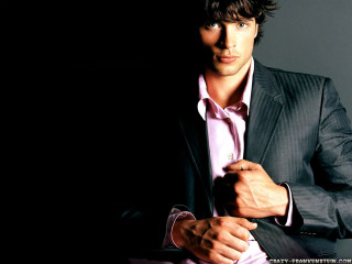 Man in suit holding tie 2 - a tie free wallpaper for desktop