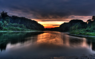 River sunset trees cloudy sky 4 - a sunset in the background and trees free wallpaper