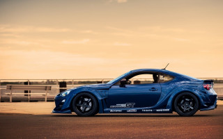 Blue sports car road fence 3 - a blue sports car free wallpaper