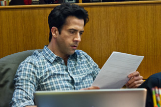 Man sitting laptop holding paper - academic free wallpaper