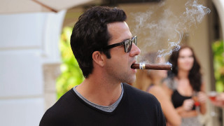 Man smoking cigarette woman behind - sunglass free wallpaper