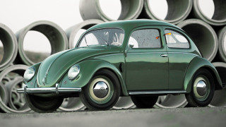 Green car pipe pile building - matte free wallpaper