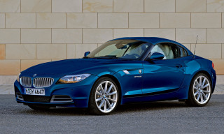 Blue bmw z4 parked brick - a door open free wallpaper