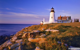 Lighthouse rocky cliff ocean sunset 2 - a lighthouse free wallpaper