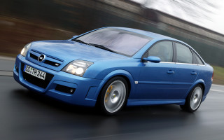 Blue car driving street forest 2 - a blue car free wallpaper