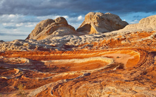 Desert landscape rocks dirt cloudy - a desert landscape free wallpaper