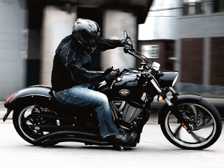 Man riding motorcycle street building - a street next free wallpaper for desktop