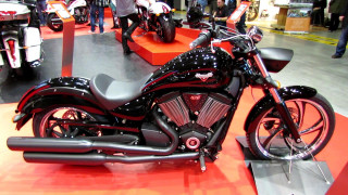 Motorcycle showroom display people looking - the floor free wallpaper