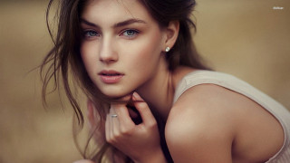 Woman ring pose brown background - a ring free wallpaper