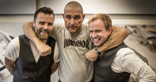 Two men hugging clock tower - a bald man free wallpaper