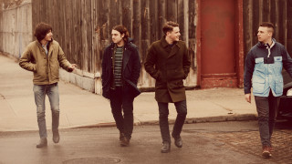 Three men walking rainy street - free vintage wallpaper