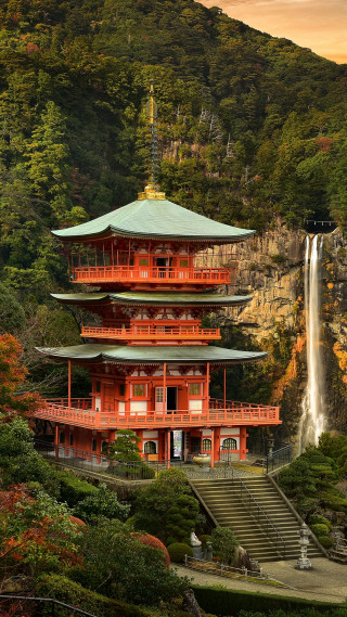 Tall red building waterfall trees - free spring wallpaper for mobile