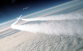 Plane flying smoke tail jet - atmospheric free wallpaper