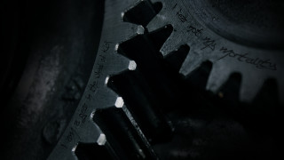 Metal gear closeup writing black - a white spot free wallpaper