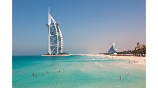 Tall building beach ocean people - a tall building free wallpaper