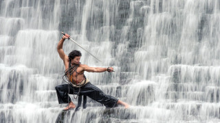 Man costume waterfall sword standing - his hand and a sword free wallpaper
