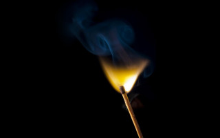 Matchstick yellow flame dark smoke - a matchstick free wallpaper