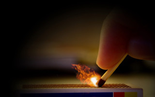 Person lighting match matchstick matchbox - fire in the background free wallpaper