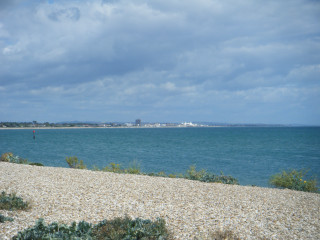 Beach ocean city person standing - plein air free wallpaper
