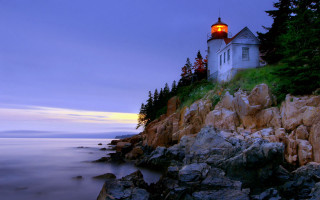 Lighthouse rocky cliff dusk water - bascove free wallpaper