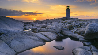 Lighthouse rocky shore sunset pond - a lighthouse free wallpaper