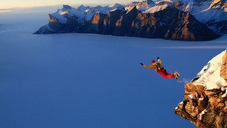 Man jumping cliff water snowboard - a snowboard free wallpaper