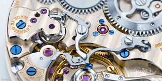 Watch gears closeup assemblage puzzle - face free wallpaper