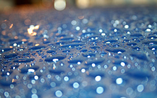 Blue surface water drops blurry - a close up free wallpaper