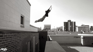 Person jumping skateboard city tall - chris spollen free wallpaper