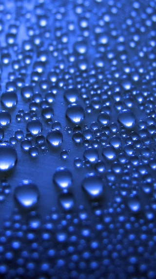Water droplets blue surface bokeh 3 - a macro photograph free wallpaper for mobile