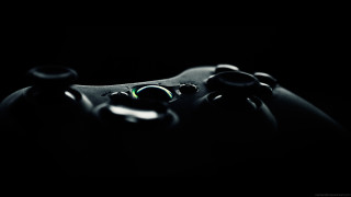 Close up video game controller 2 - a green light free wallpaper