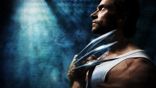 Man holding scissors blue background - plasticien free wallpaper