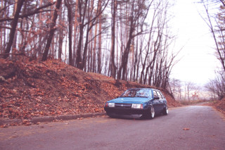 Blue car parked road hill - scenery free wallpaper