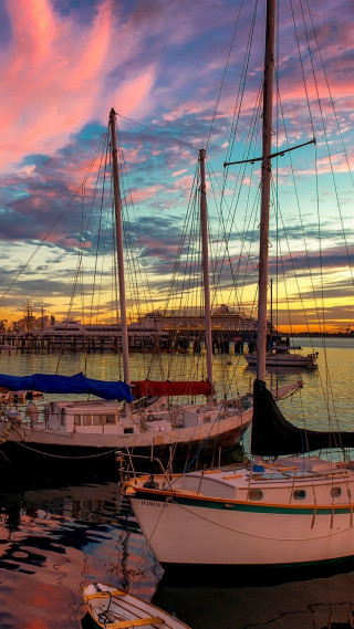 Sailboats docked pier sunset colorful - free summer wallpaper