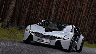 White bmw concept car forest - a forest of trees and grass free wallpaper