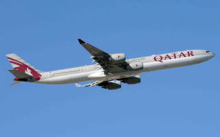 Qatar passenger jet flying blue - a large passenger free wallpaper