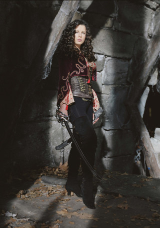 Woman costume sword dog cave - a stone wall free wallpaper for mobile