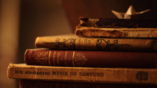 Stack of books paper boat - vintage free wallpaper