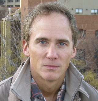 Man jacket plaid shirt looking - free portrait wallpaper for tablet