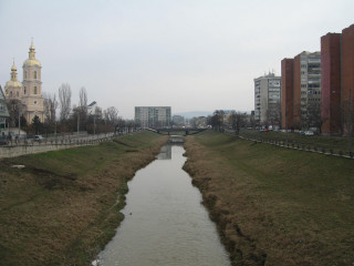 River lush field tall buildings - danube school free wallpaper for desktop