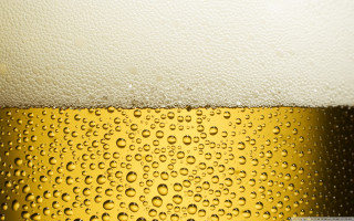 Beer closeup waterdrops yellow black - adolf bierbrauer free wallpaper