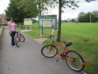 Woman red bike sidewalk sign - aileen eagleton free wallpaper