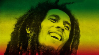 Man laughing dreadlocks red shirt - a rainbow background free wallpaper