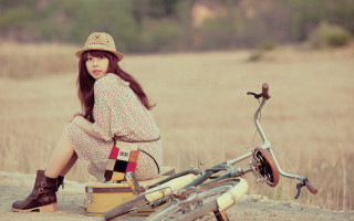 Woman sitting dirt road bike - a dirt road next free wallpaper