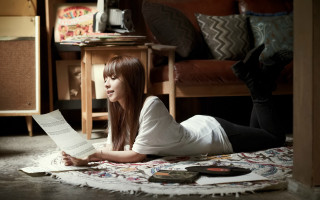 Woman reading book smiling remote - a book free wallpaper